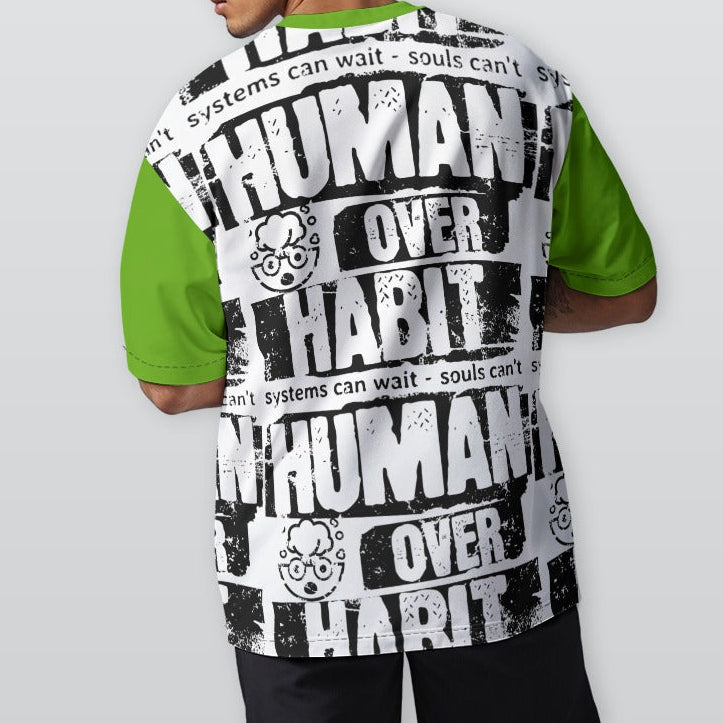 Person wearing a shirt with 'Human Over Habit' text on a plain background
