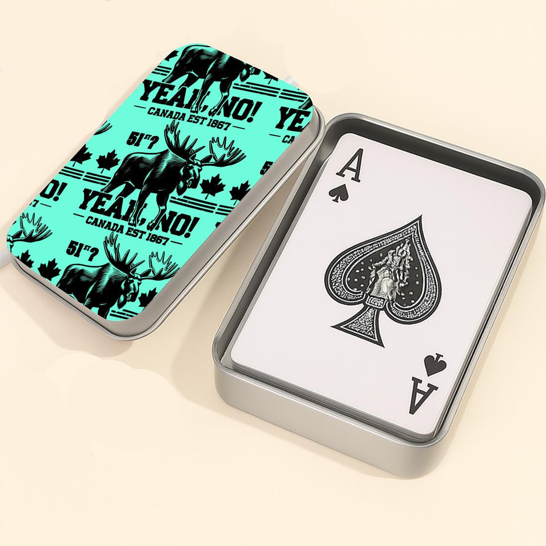 Playing cards with a moose design on the case and an Ace of Spades card, accompanied by a die.