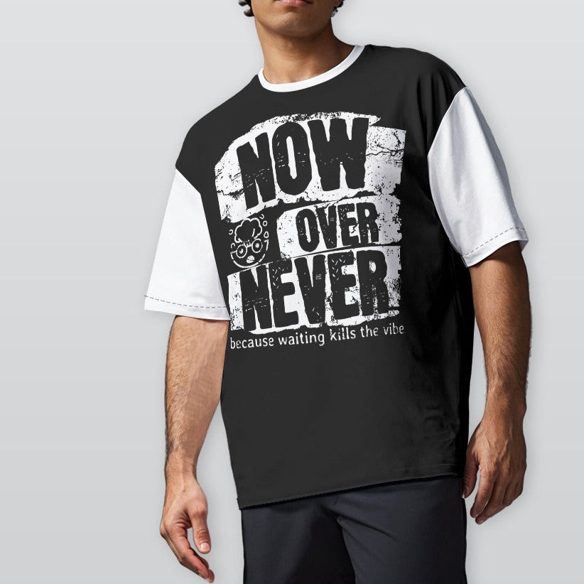 Man wearing a black and white t-shirt with text on a plain background