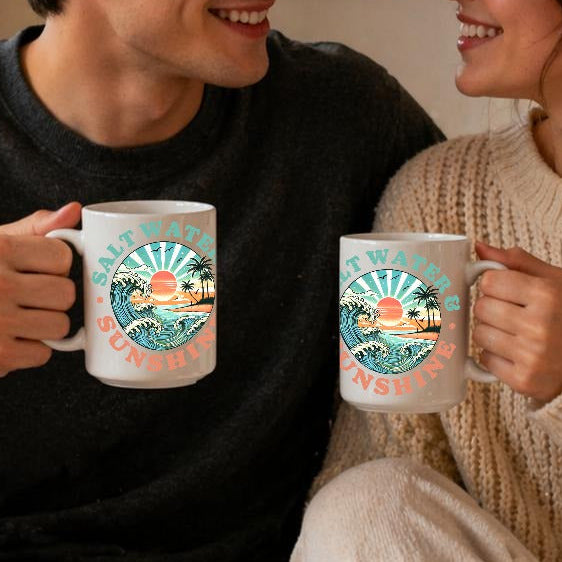 Man and woman sitting together holding mugs in a cozy room.