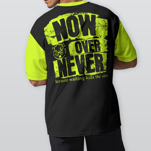 Person wearing a black and neon yellow t-shirt with text on the back, standing against a plain background
