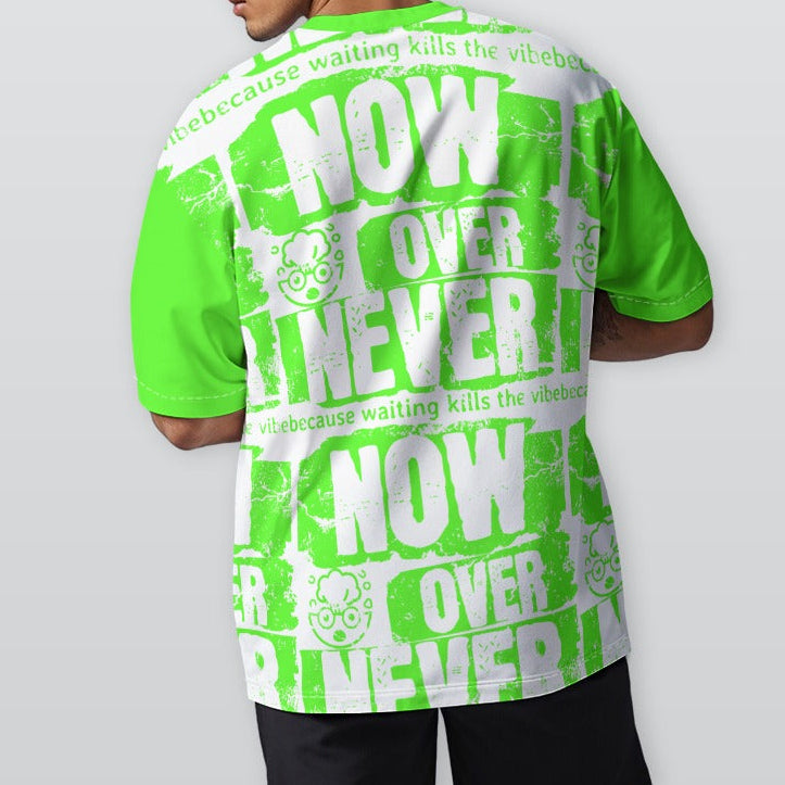 Person wearing a bright green and white graphic t-shirt with text on a plain background