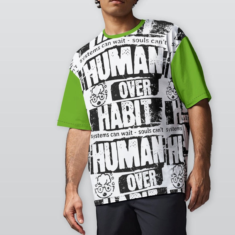 Person wearing a graphic t-shirt with text and green sleeves on a plain background