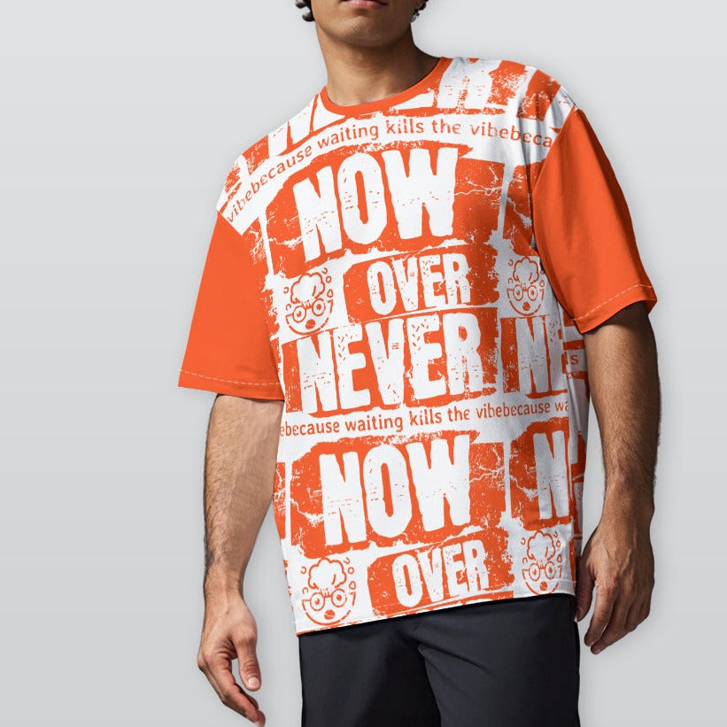 Person wearing an orange and white graphic t-shirt with text on a plain background