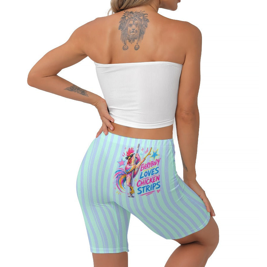 A woman shown from the back wearing light blue and seafoam striped biker shorts with a colourful graphic and text on the back, paired with a white strapless crop top against a plain white background.