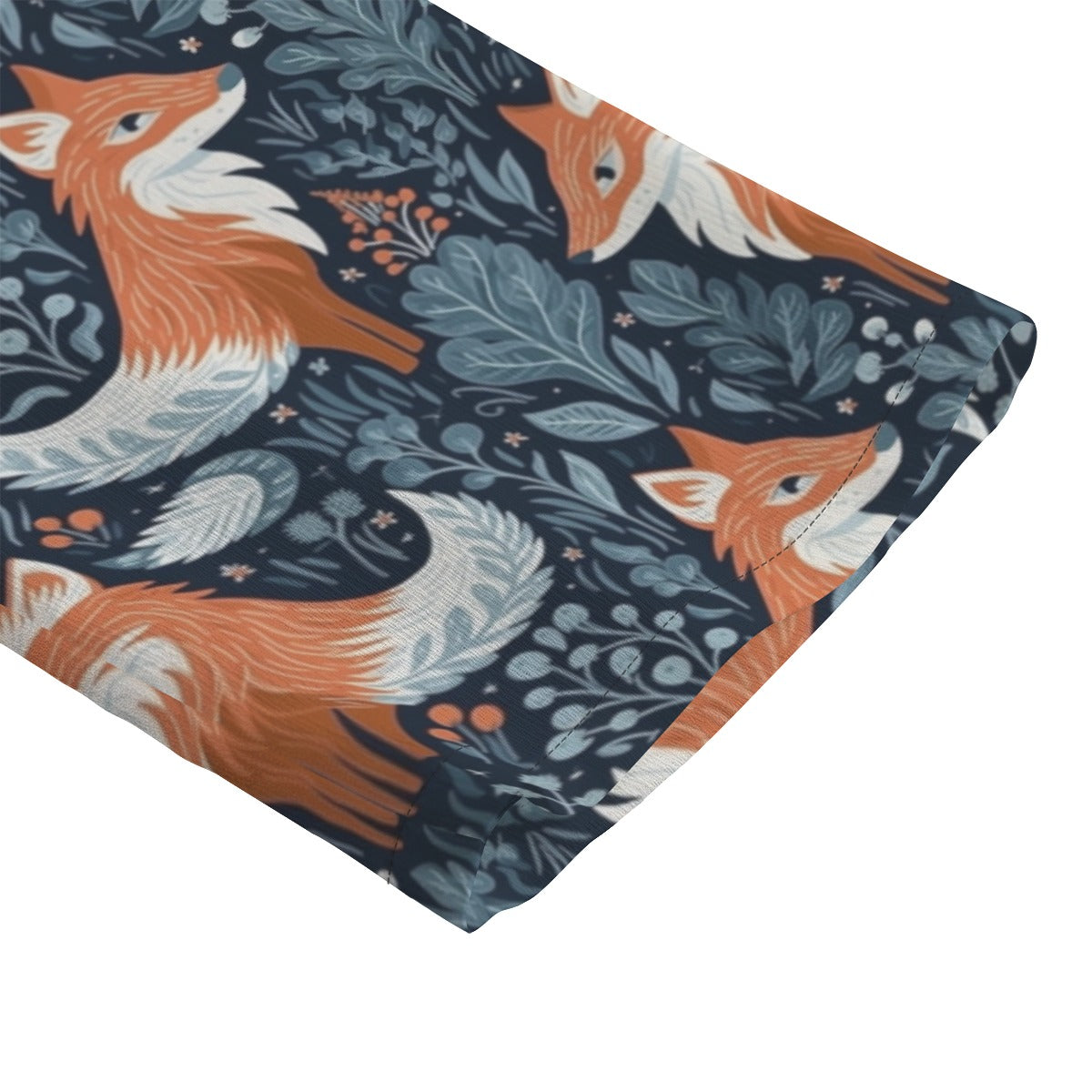 Close Up of hem with fox and floral pattern on a white background