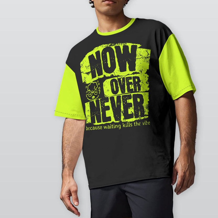 Person wearing a black and neon yellow t-shirt with text on a plain background