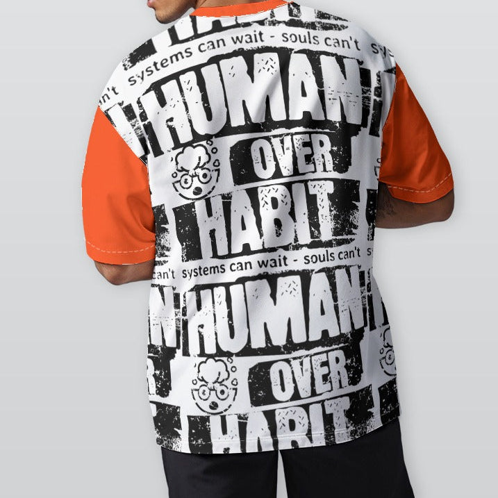 Person wearing a shirt with 'Human Over Habit' text on a plain background