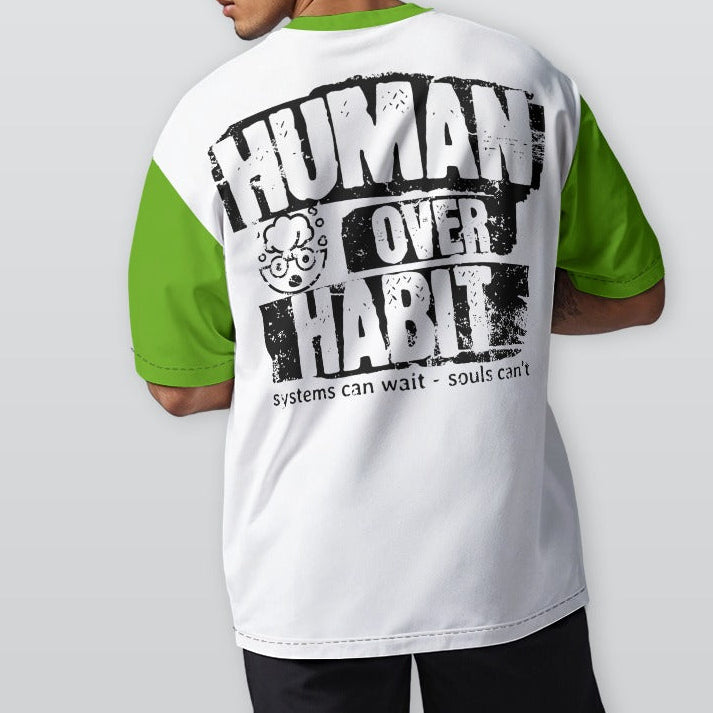 Person wearing a white t-shirt with green sleeves and 'Human Over Habit' text on the back.