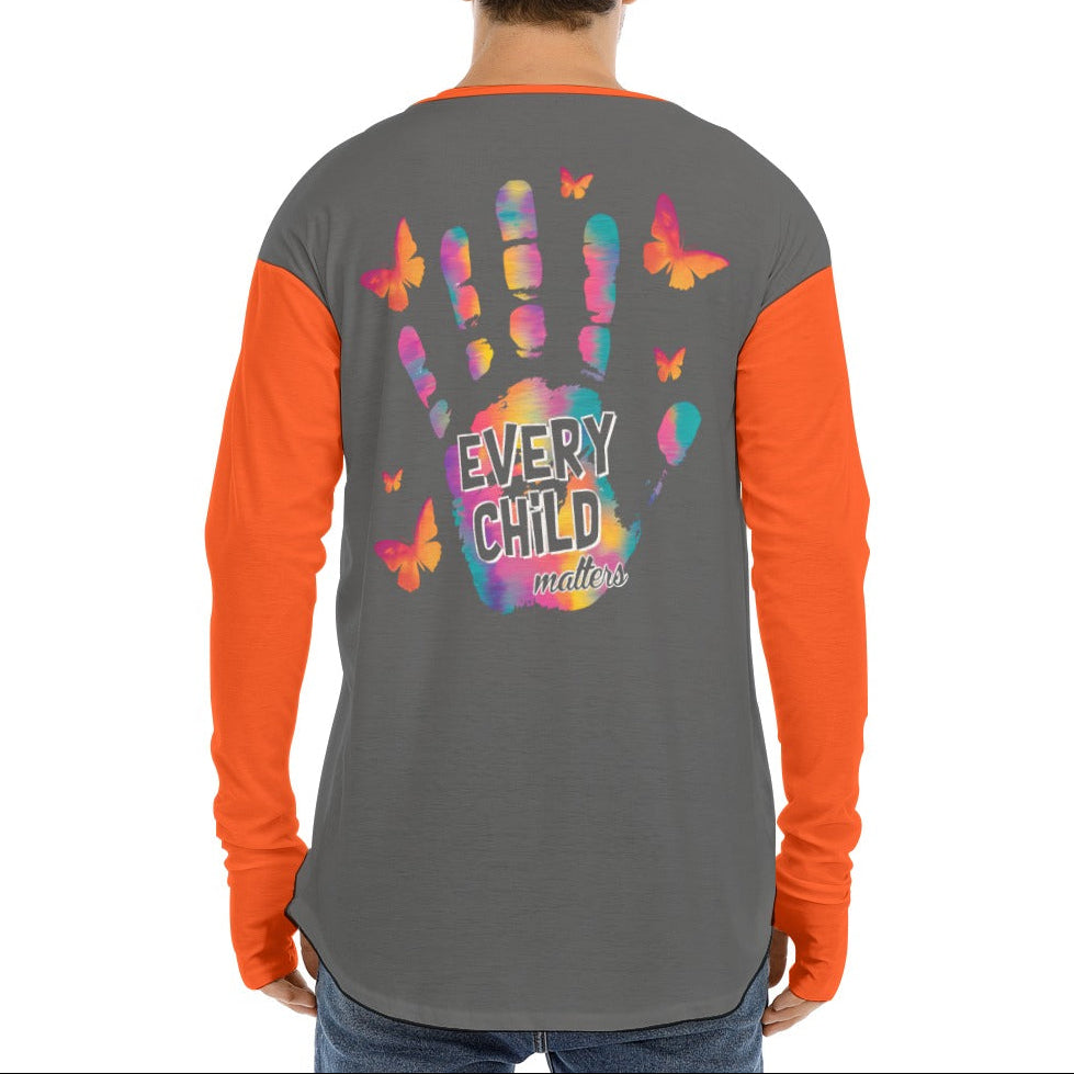 Person wearing a shirt with colorful handprints and butterflies on the back