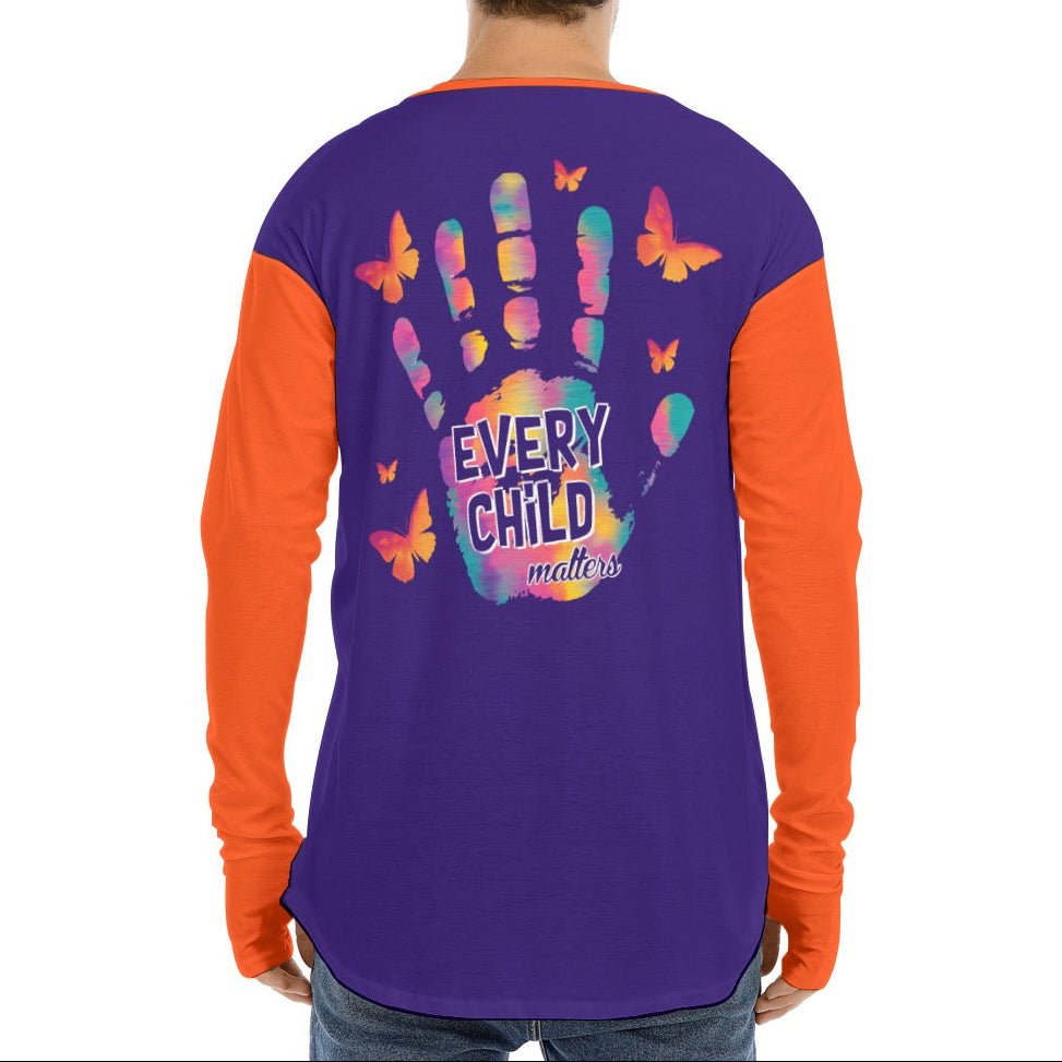 Person wearing a purple and orange shirt with a colorful handprint design and text on the back.