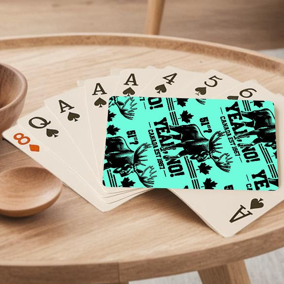 Wooden table with a bowl of lemons, wooden spoon, and playing cards in a living room setting.