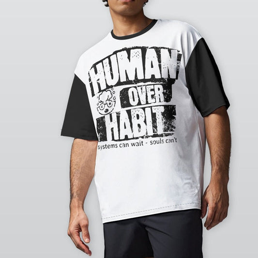 Person wearing a white t-shirt with black text and graphics on a plain background