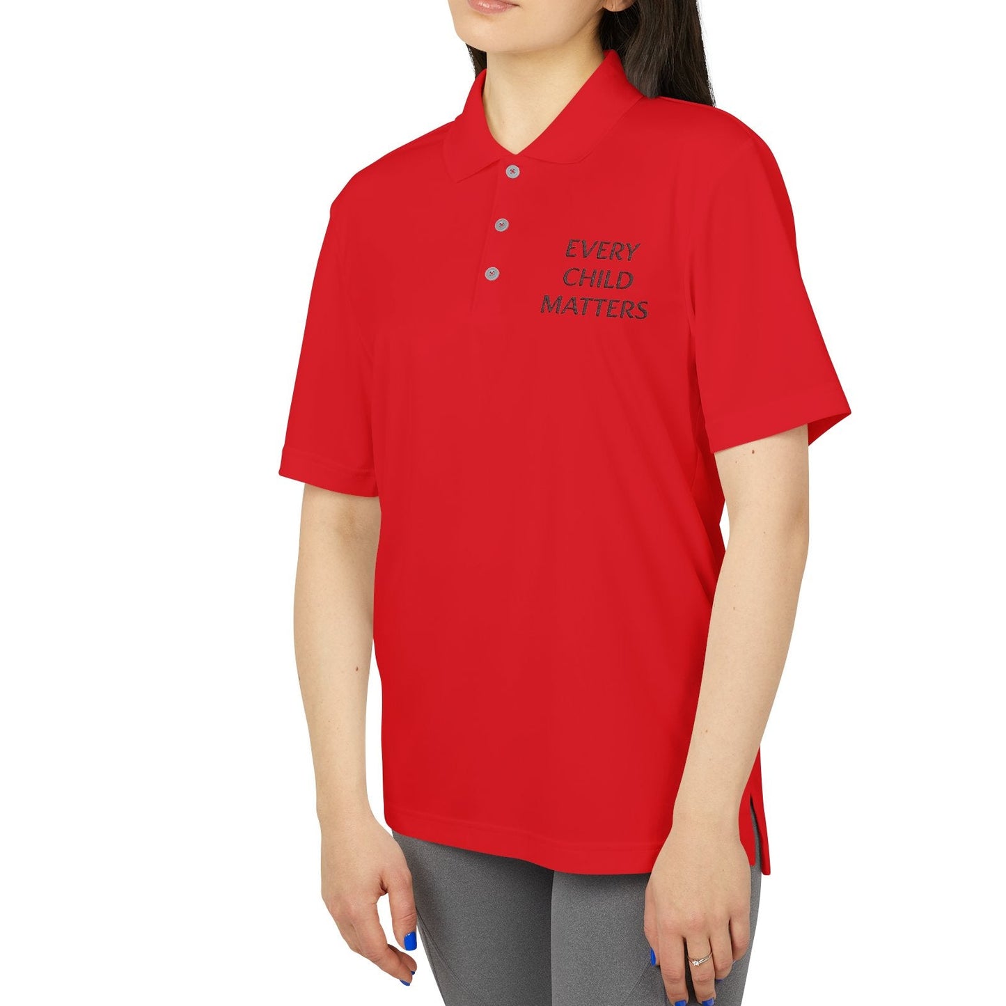Person wearing a red polo shirt with 'Every Child Matters' text on a white background