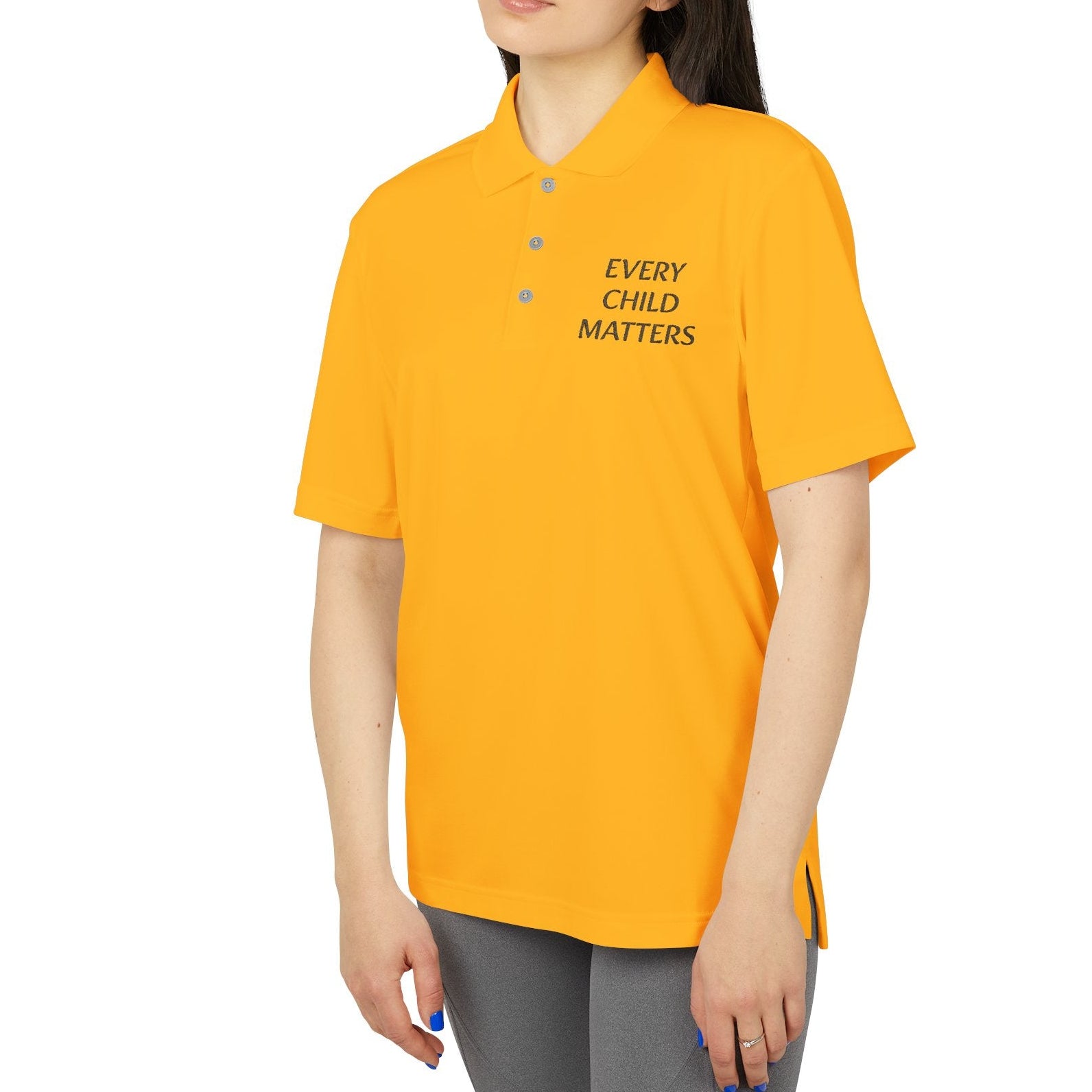 Person wearing a yellow polo shirt with 'EVERY CHILD MATTERS' text on a white background