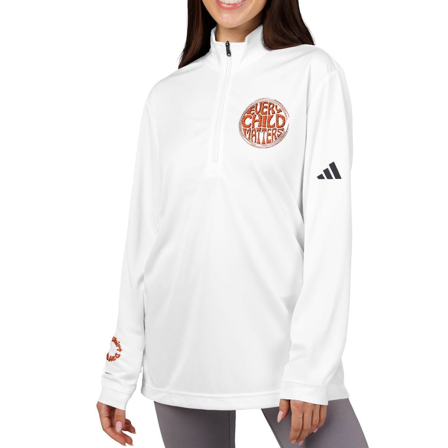 Woman wearing a white Adidas jacket with text on a white background