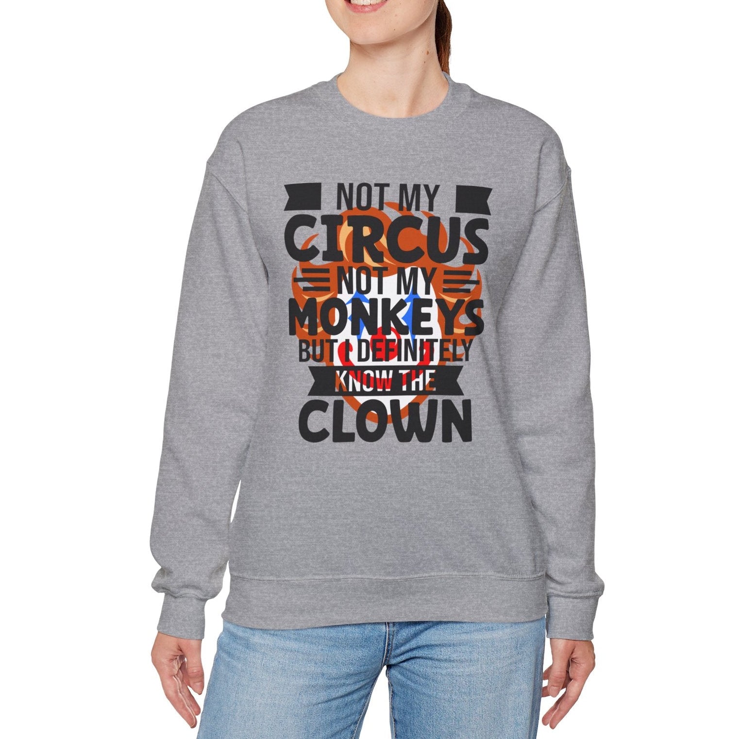 Person wearing a gray sweatshirt with a humorous text design on a white background