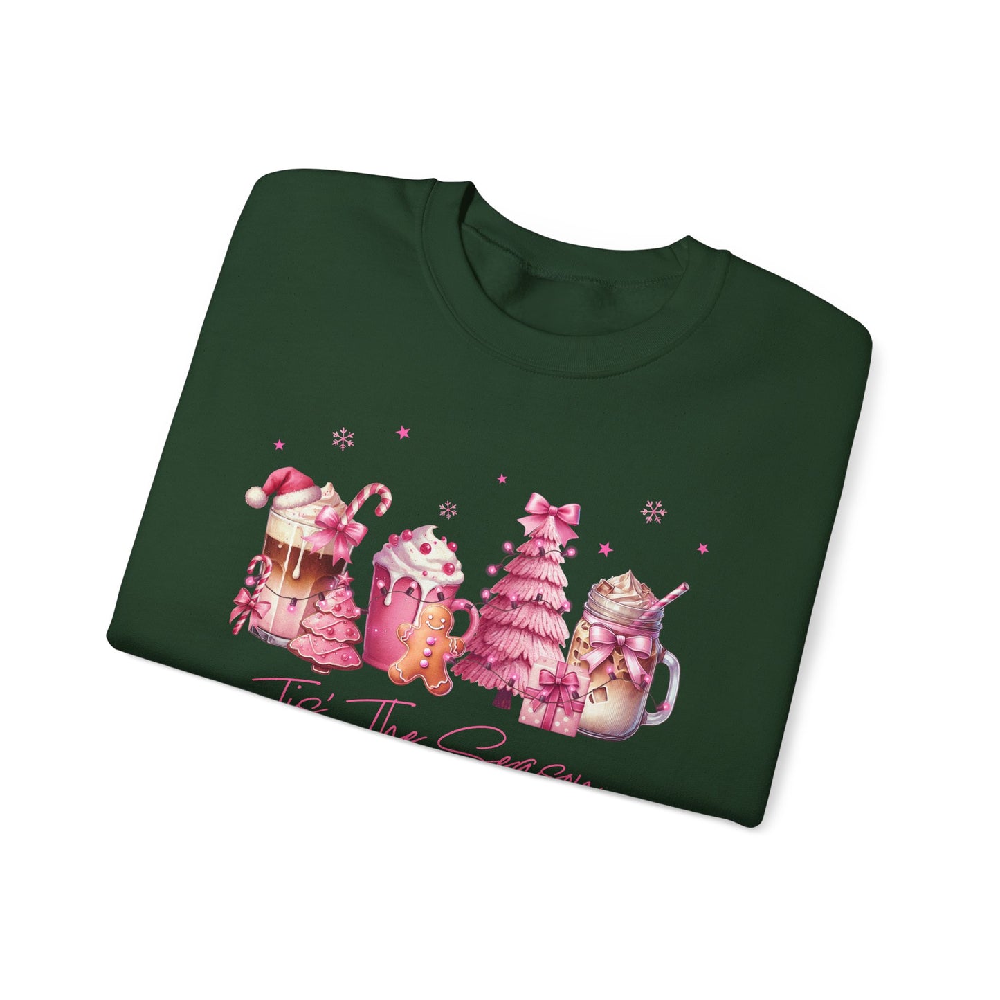 Folded green sweatshirt with Christmas-themed design on a white background