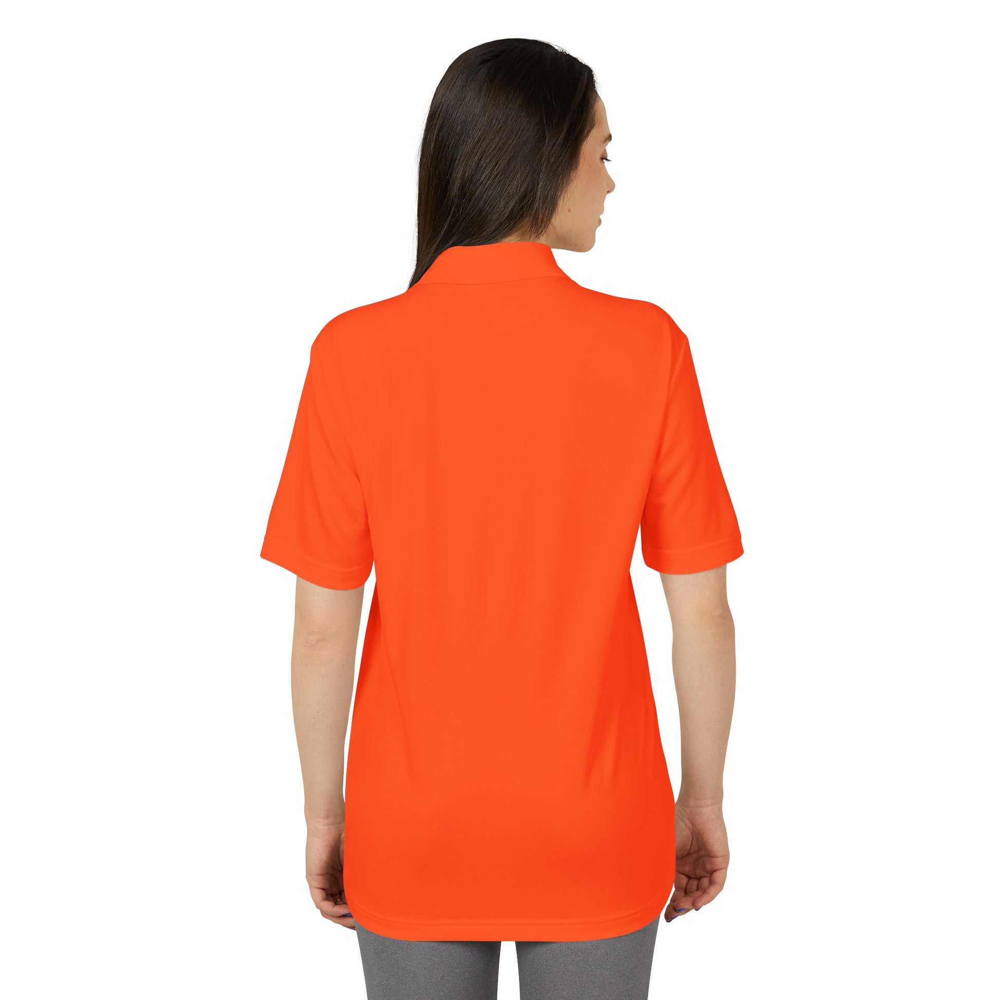 Person wearing an orange polo shirt on a white background