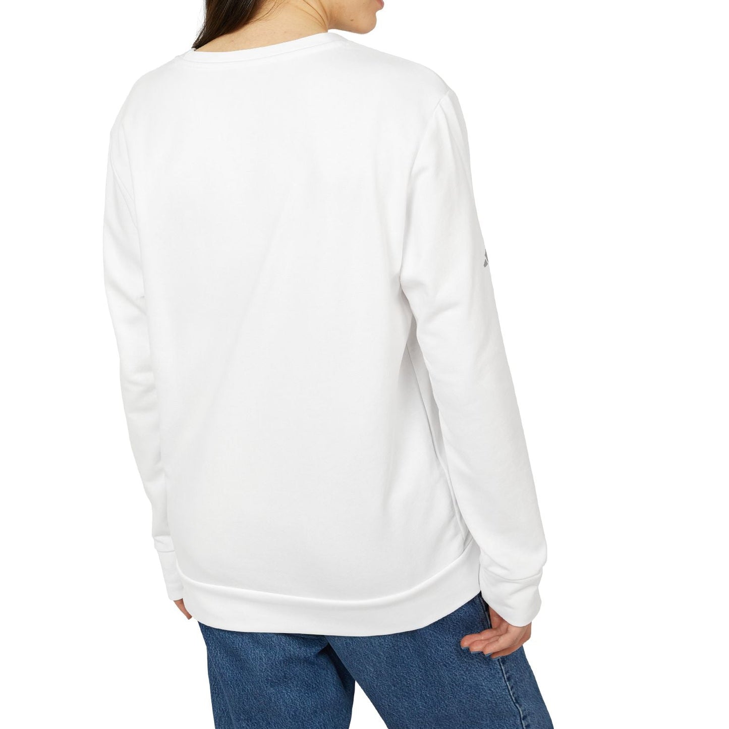 Woman wearing a white sweatshirt and blue jeans on a white background