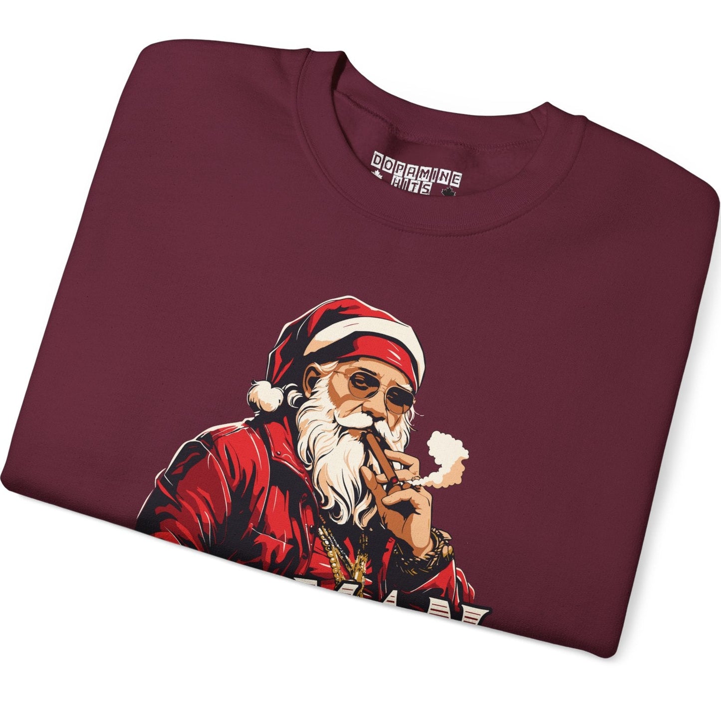 Folded maroon t-shirt with a graphic of a smoking Santa Claus on a white background