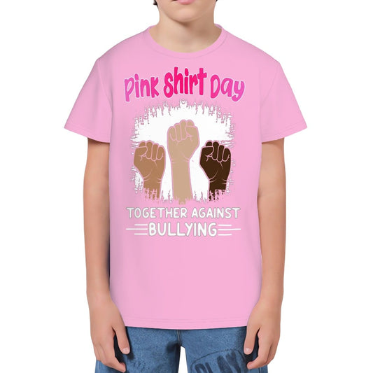 Youth wearing a pink t-shirt with 'Pink Shirt Day' text and raised fists graphic.
