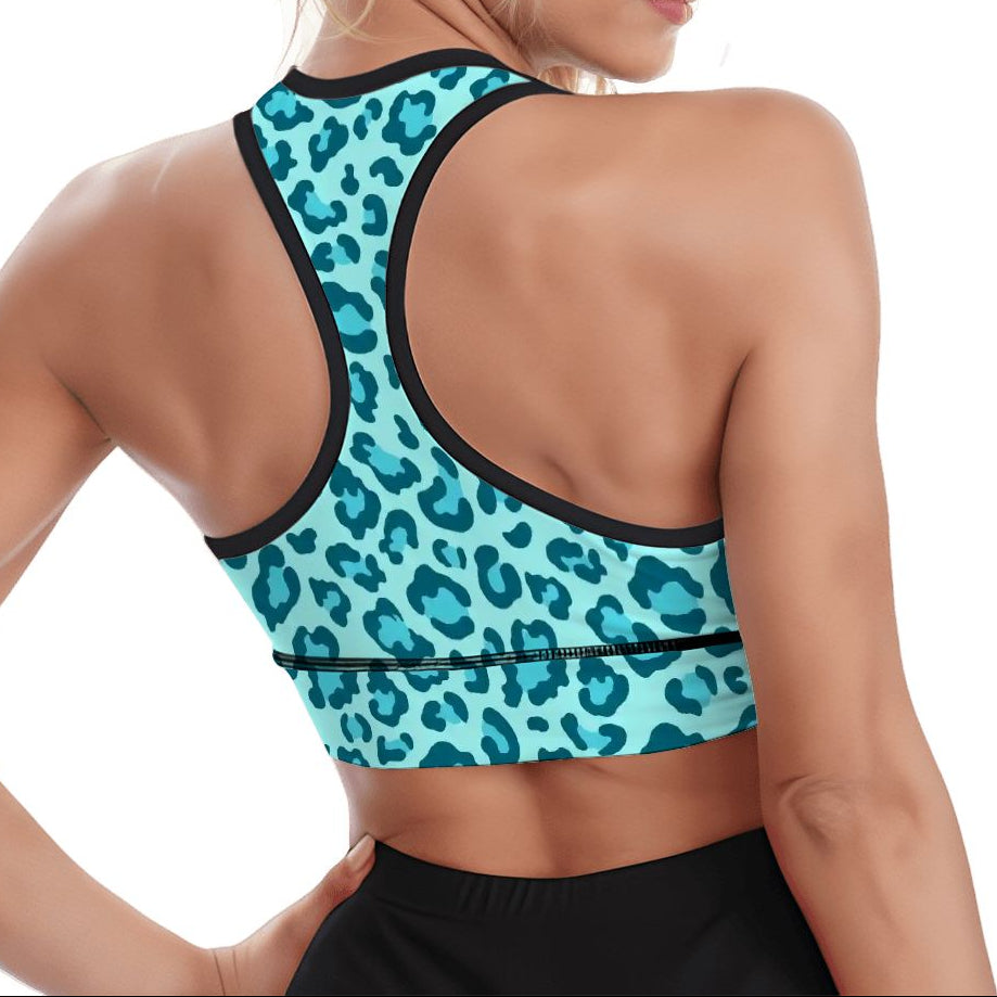Woman wearing a blue leopard print sports bra on a white background