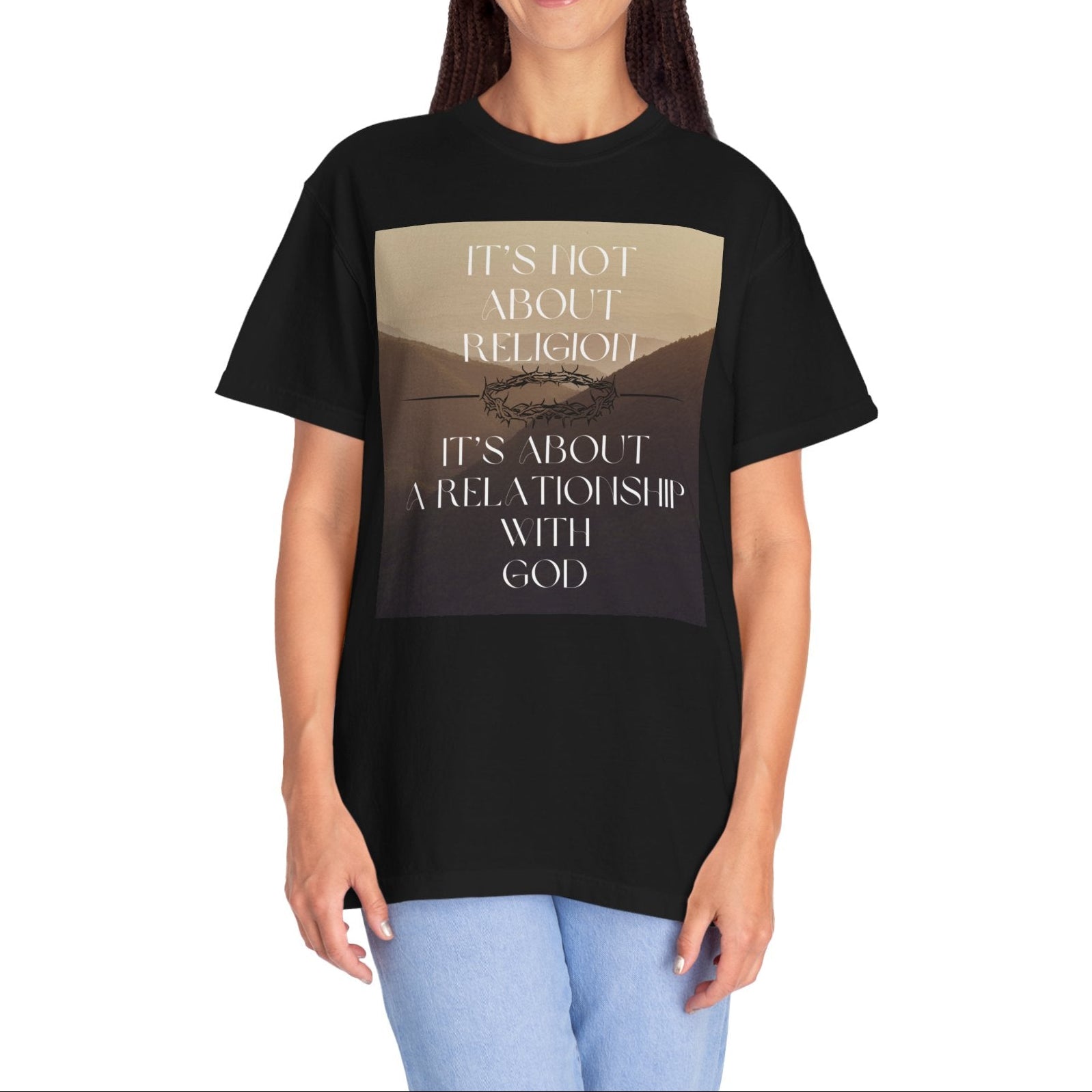 Person wearing a black t-shirt with text and a graphic design on a white background