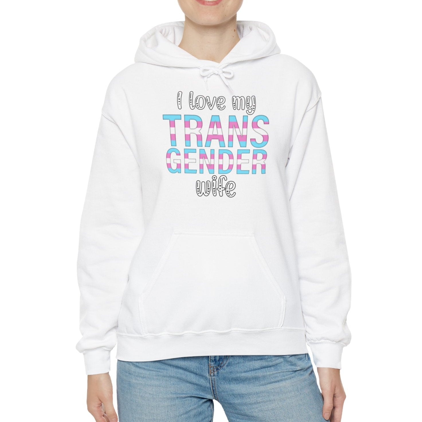 Person wearing a white hoodie with colorful text on a white background
