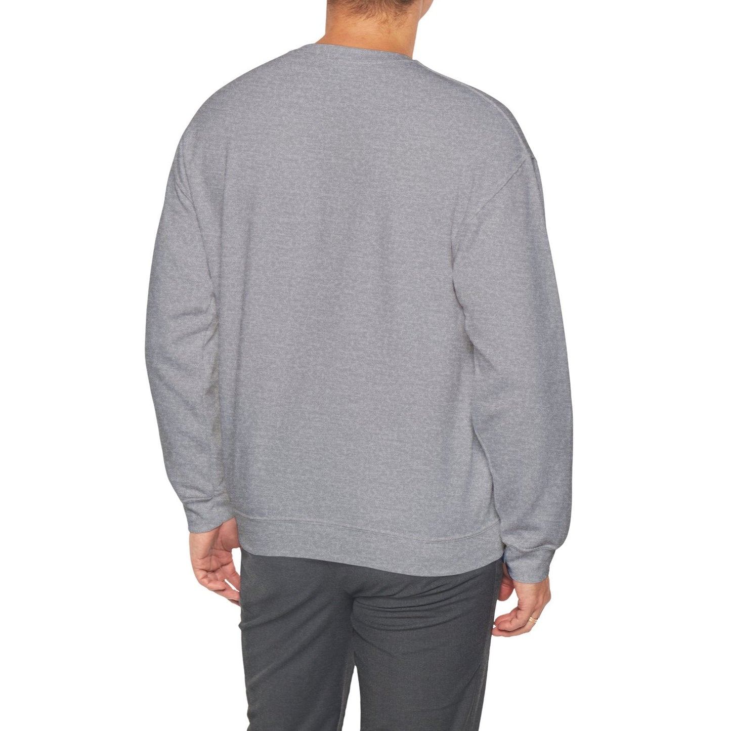 Man wearing a gray sweatshirt and pants on a white background