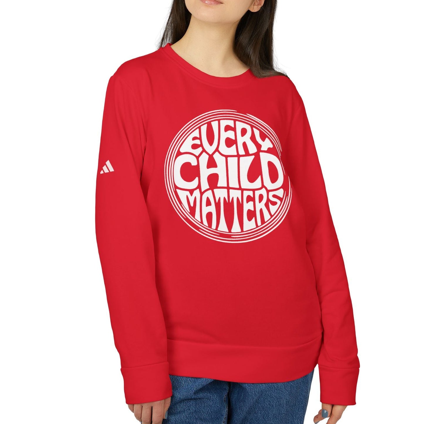 Person wearing a red sweatshirt with 'Every Child Matters' text on a white background