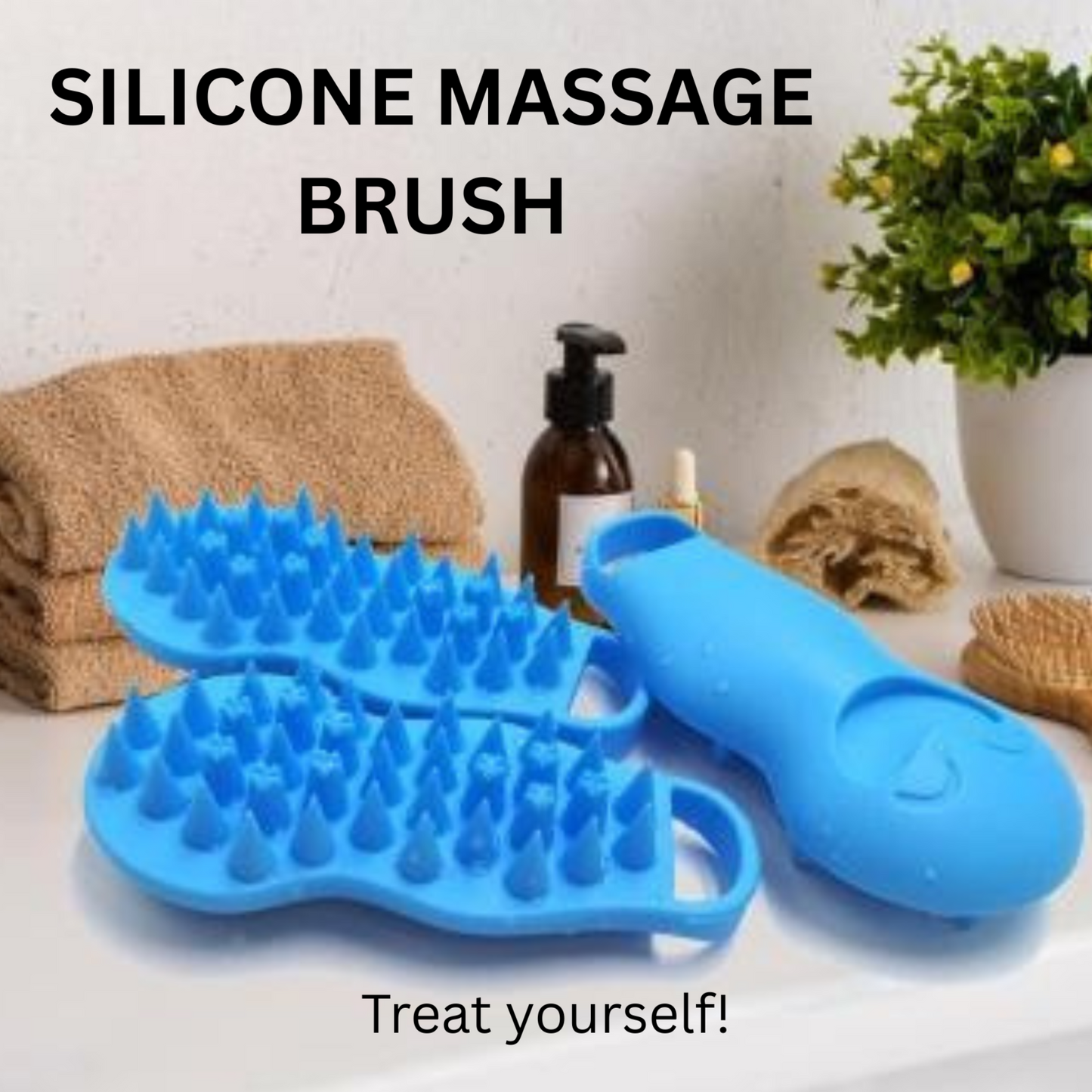 Blue silicone massage brush on a white surface with towels and a plant in the background.