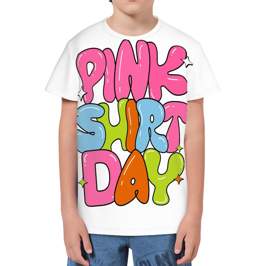Youth wearing a white t-shirt with colorful text 'Pink Shirt Day' on a white background