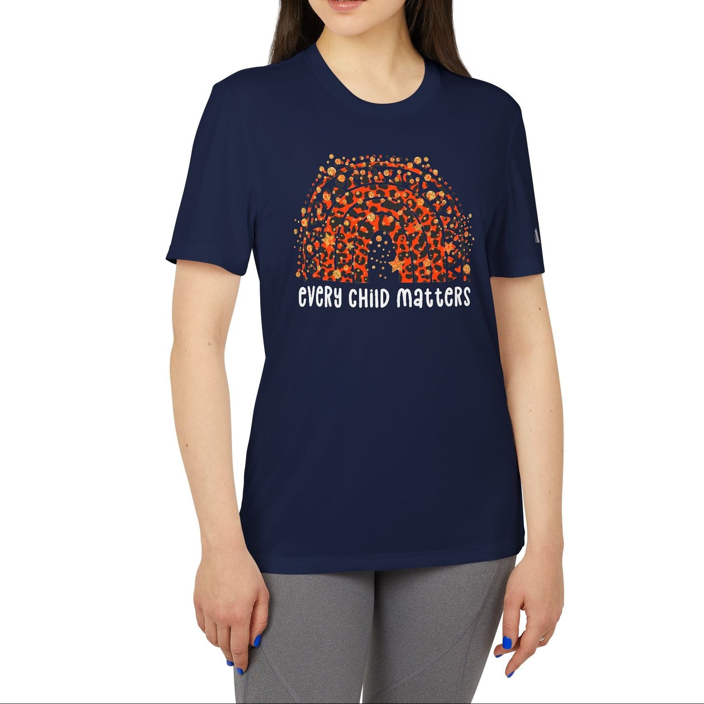 Woman wearing a navy blue t-shirt with 'Every Child Matters' design on a white background