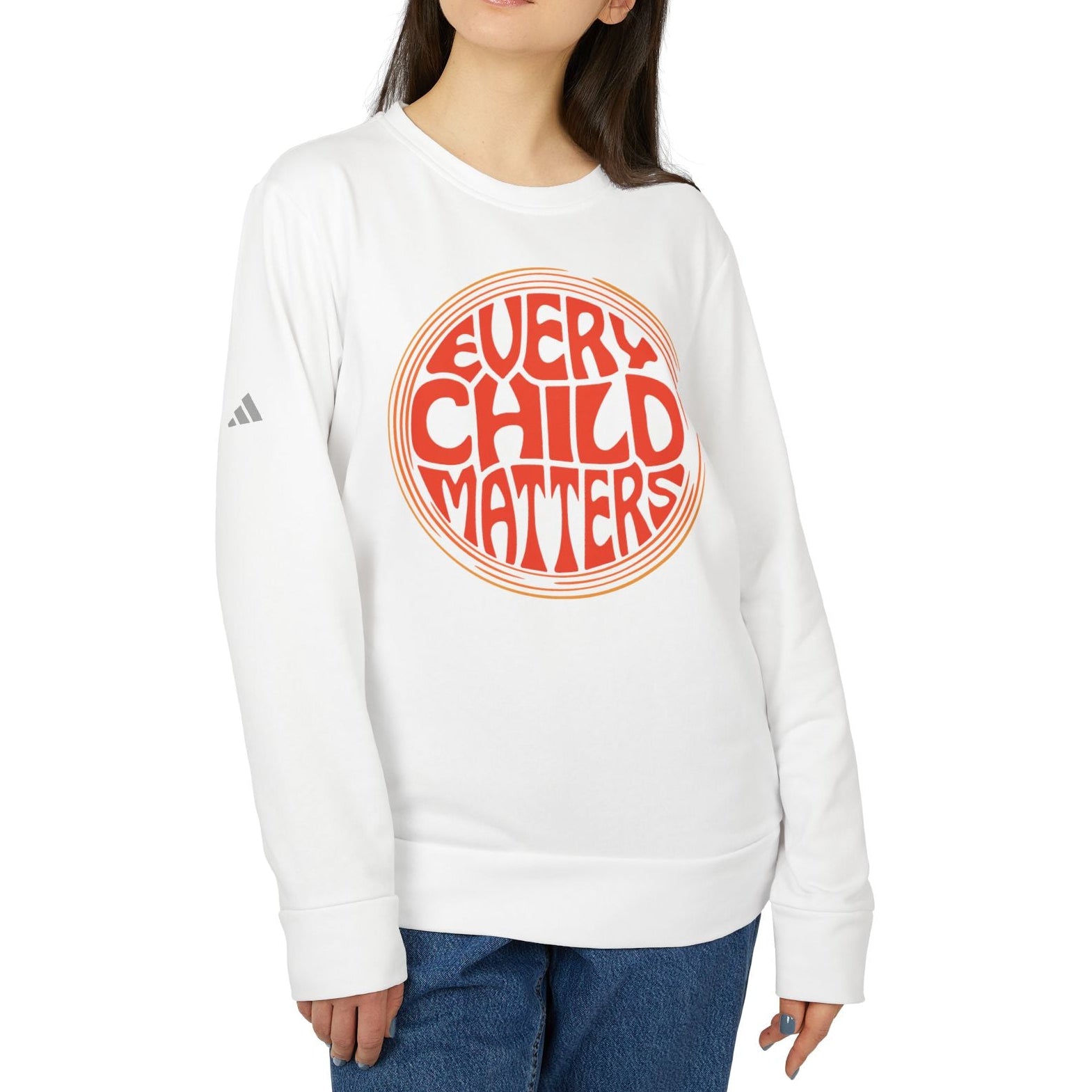 Person wearing a white sweatshirt with 'Every Child Matters' text on a white background