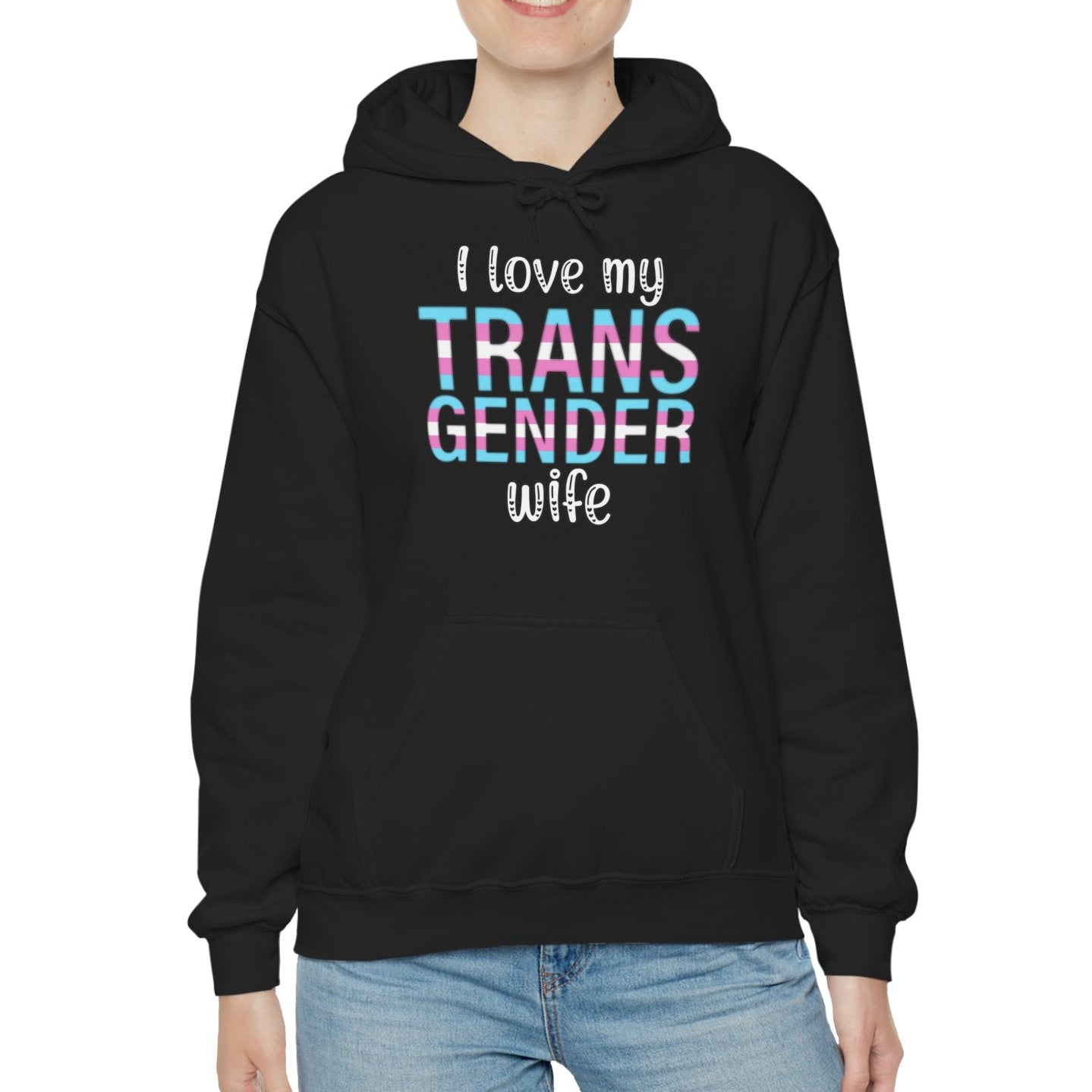 Person wearing a black hoodie with 'I love my TRANS GENDER wife' text on a white background