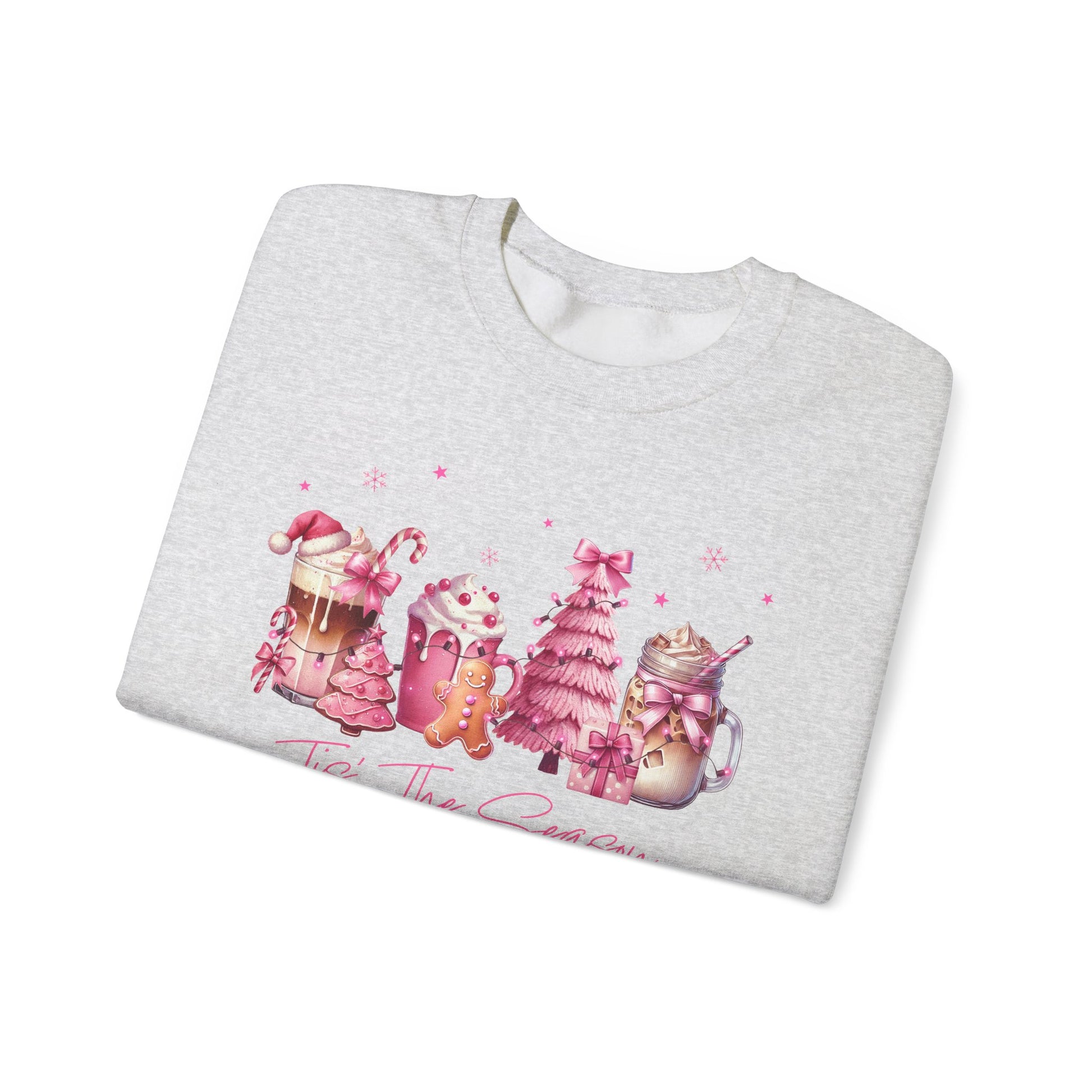 Folded gray sweatshirt with Christmas-themed design on a white background