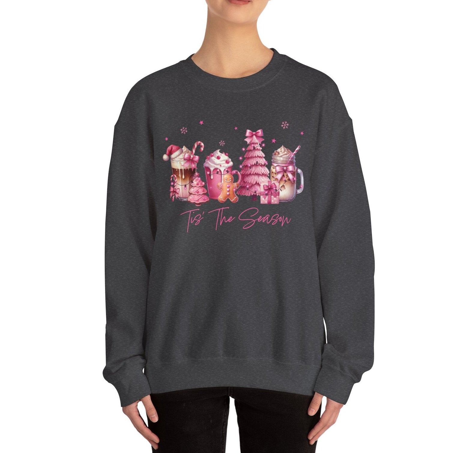 Person wearing a dark gray sweatshirt with a festive design on a white background