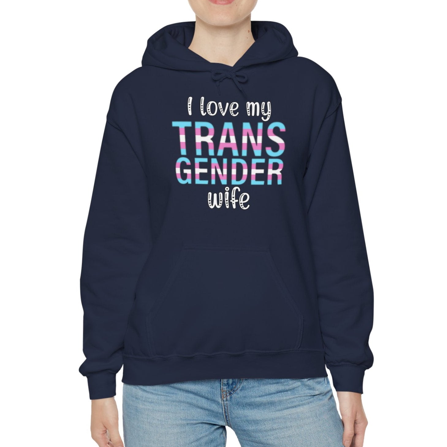 Person wearing a navy hoodie with 'I love my TRANS GENDER wife' text on a white background