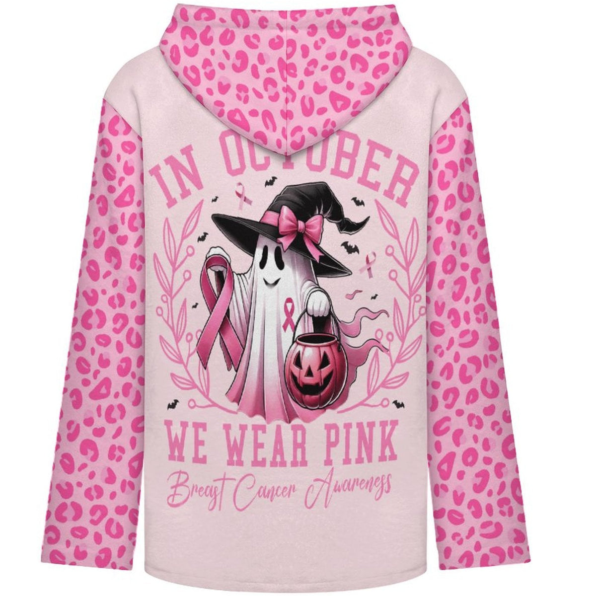 A light pink hoodie with bright pink leopard print sleeves and hood, featuring a Halloween-themed breast cancer awareness graphic on the back. The graphic includes a ghost in a witch hat, a pink breast cancer ribbon, a jack-o'-lantern, and the text 'IN OCTOBER WE WEAR PINK - Breast Cancer Awareness'.