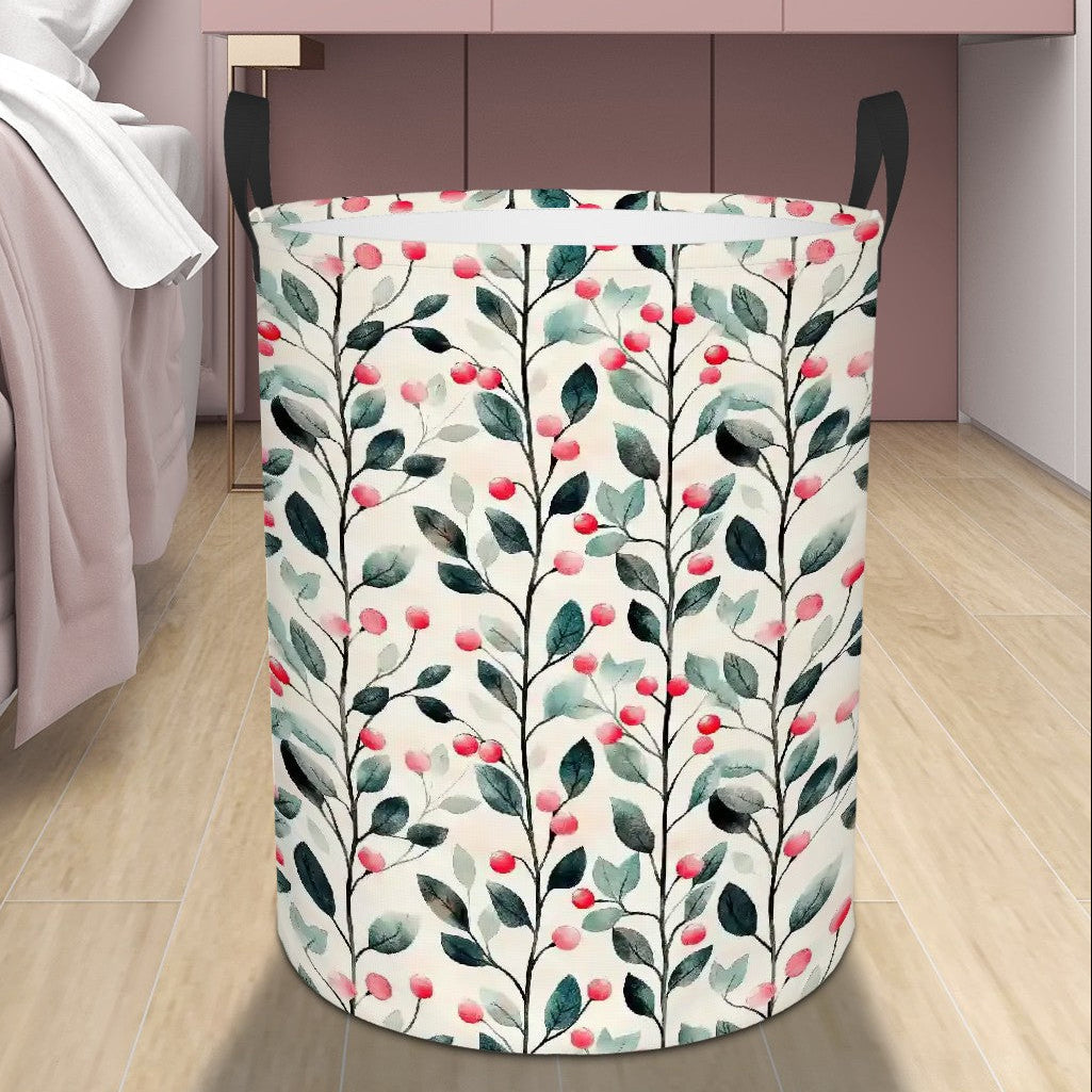Floral-patterned laundry basket on a wooden floor next to a bed.