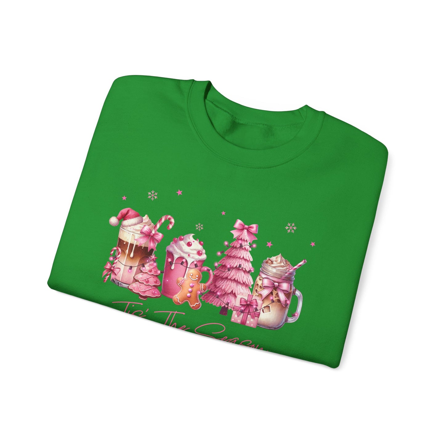 Green folded sweatshirt with Christmas-themed design on a white background