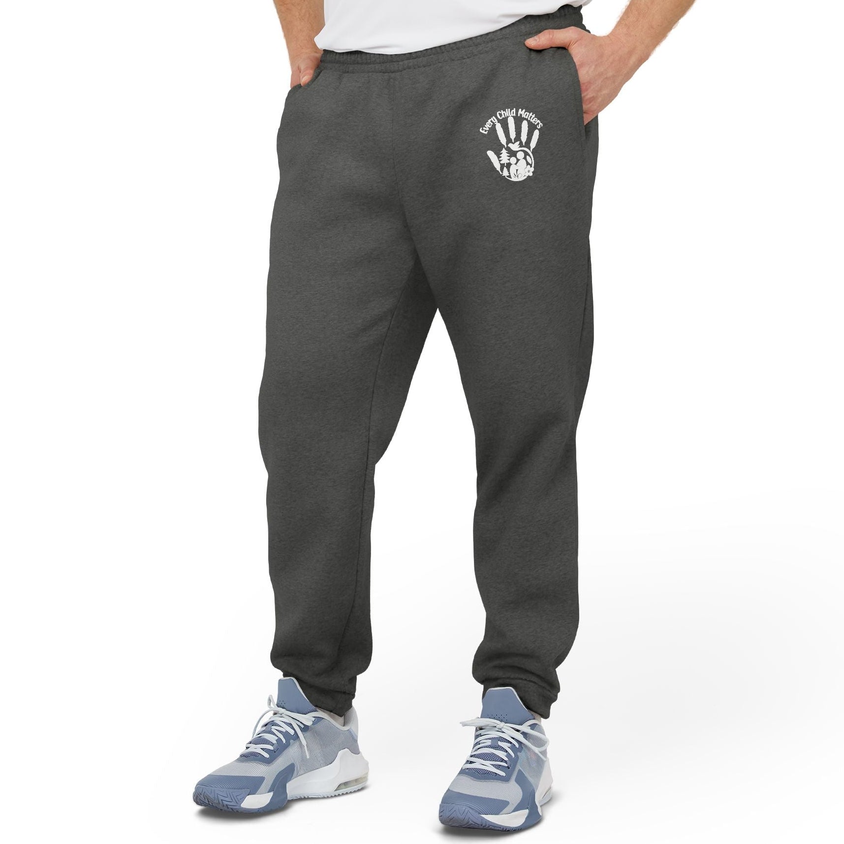 Person wearing dark gray sweatpants with a logo on a white background