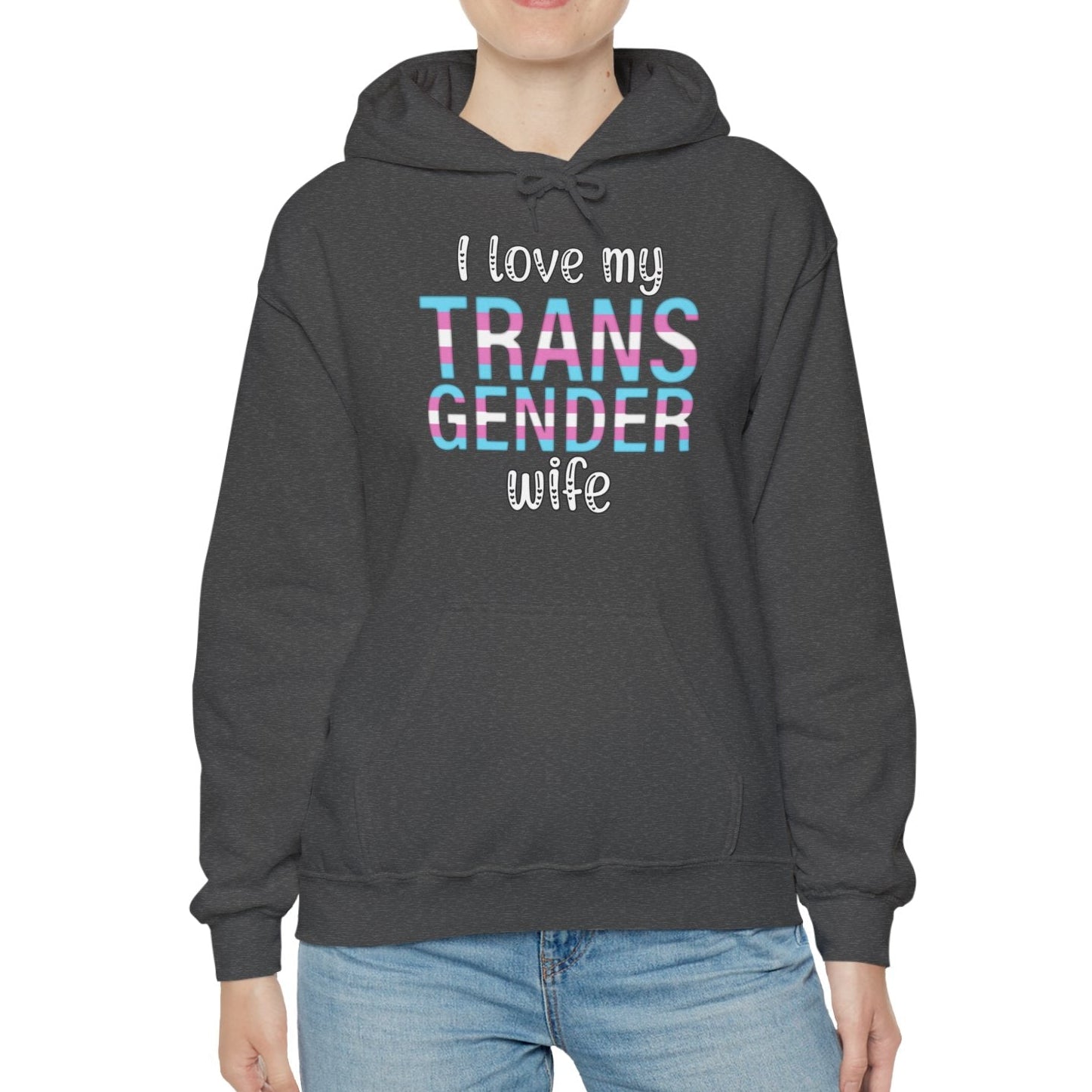 Person wearing a dark gray hoodie with 'I love my TRANS GENDER wife' text on a white background