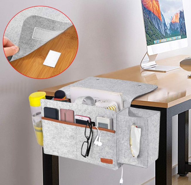 Desk organizer with pockets holding office supplies on a desk.