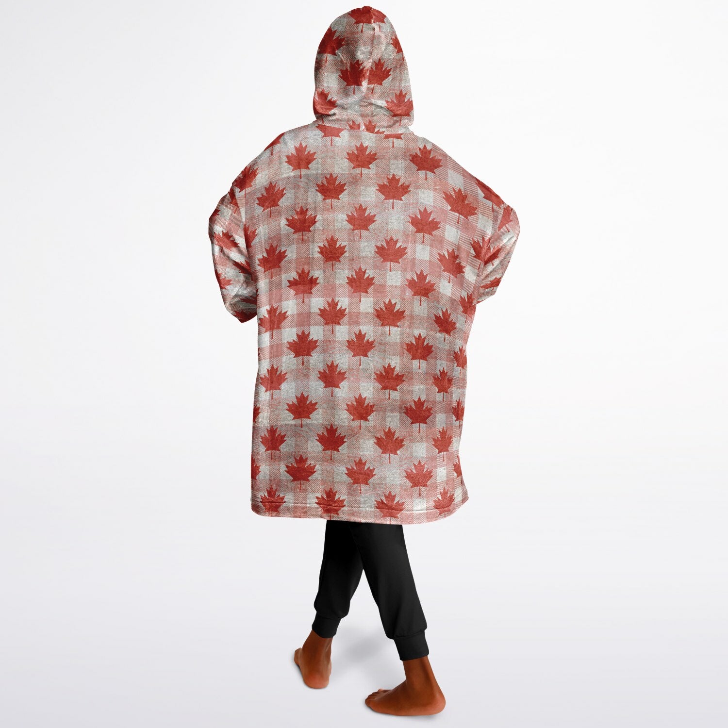 Person wearing a red maple leaf patterned hoodie on a white background