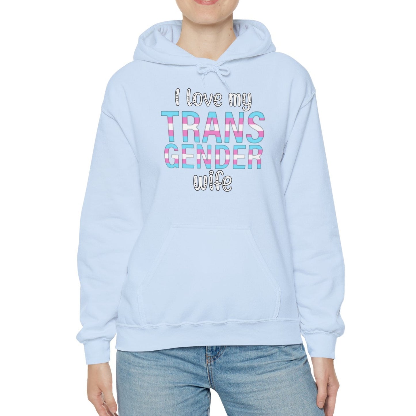 Person wearing a light blue hoodie with text, standing against a white background