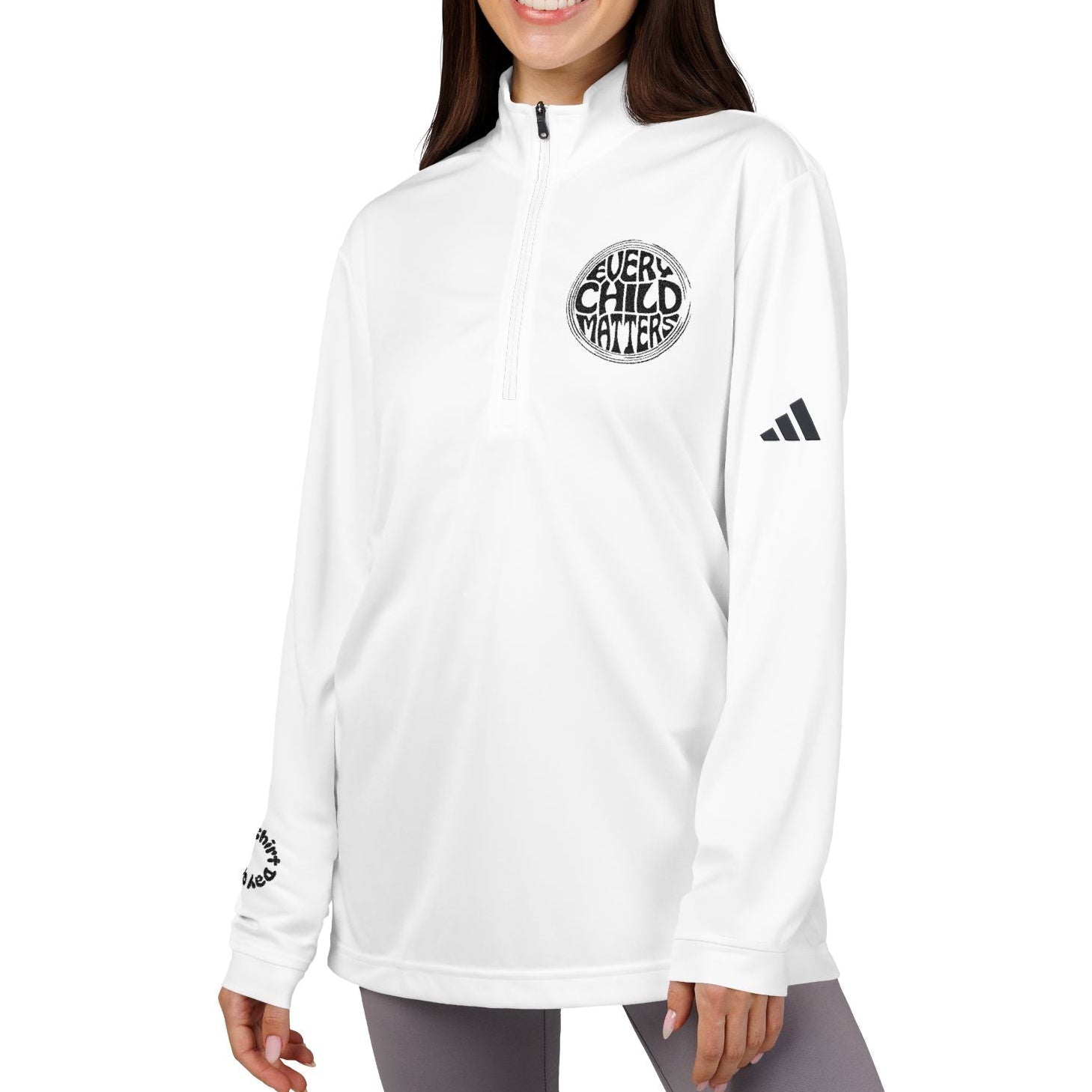 Woman wearing a white Adidas jacket with a logo on a white background