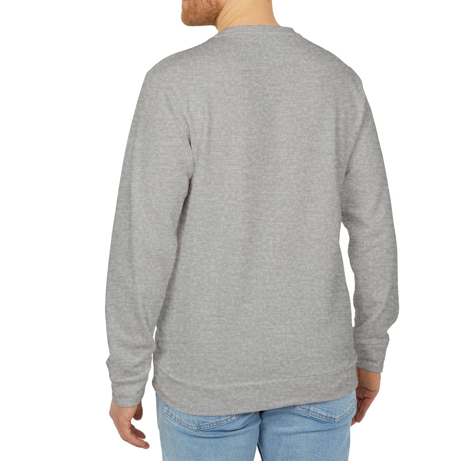 Man wearing a gray sweatshirt and light blue jeans on a white background