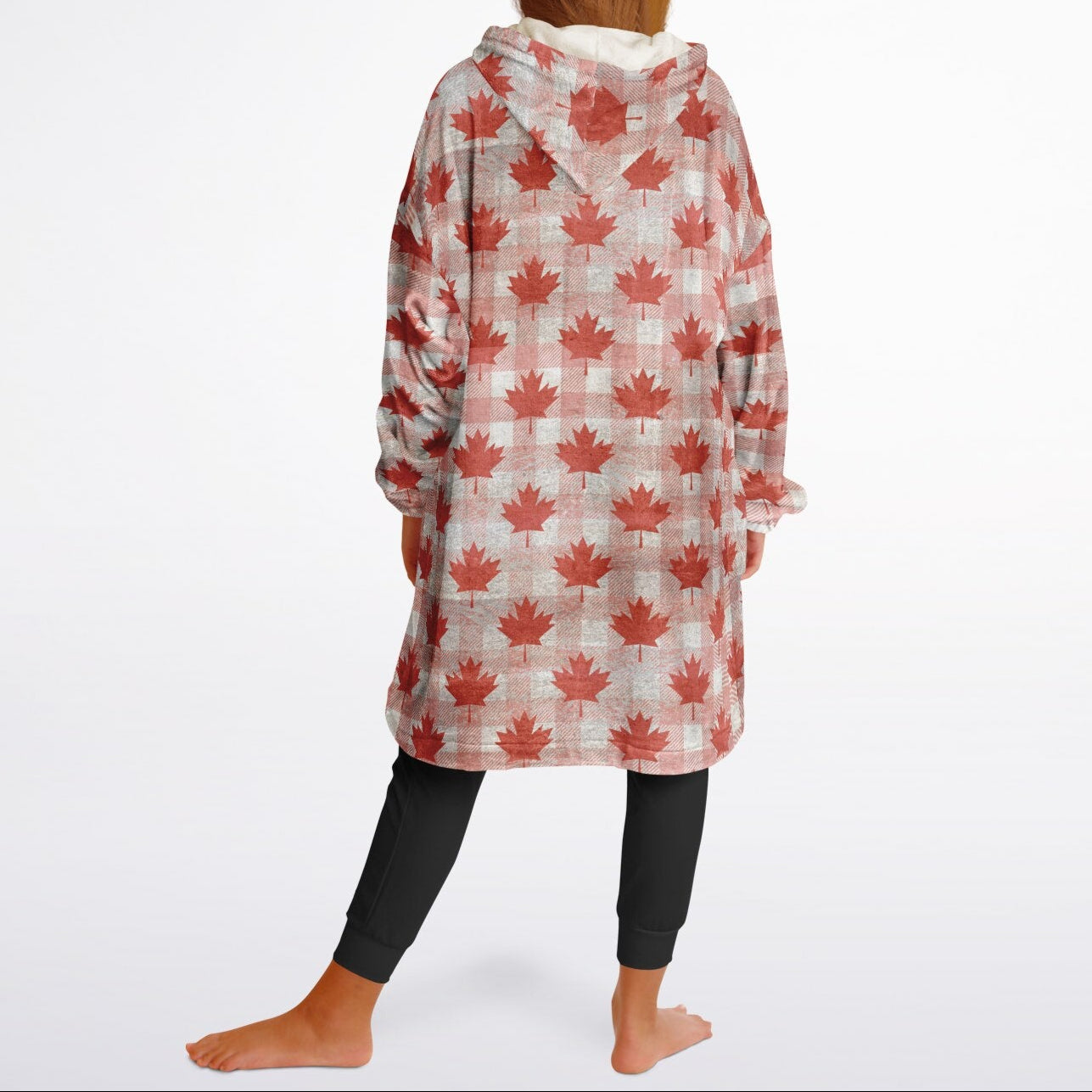 Person wearing a red maple leaf patterned robe on a white background